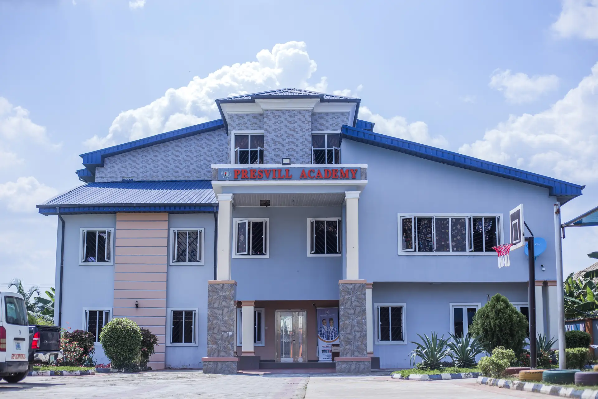 The Presvill Academy building on Abel Damina Way, Uyo, with its blue roof and the school's name over the entrance