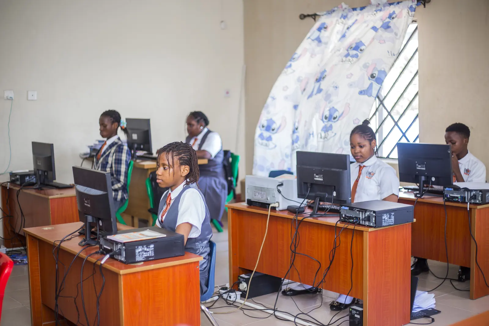 Pupils at desktop computers in the ICT laboratory