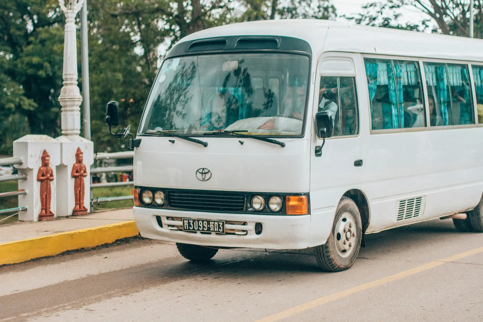Illustrative photo: a white minibus parked at the roadside